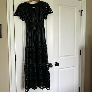 The Somerset maxi dress from Anthropologie in black Faux leather.